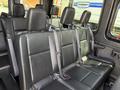 2019 Mercedes-Benz Sprinter interior featuring multiple black leather seats with seatbelts
