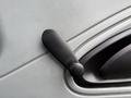 A black manual window crank for a 2007 International 4200 truck door