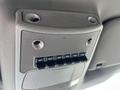 Overhead control panel of a 2019 Ford F-350 SD featuring six auxiliary switches and speaker grilles