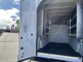 The image shows the open back of a 2019 Ford F-350 SD with a spacious interior featuring metal shelves and a flat floor