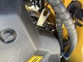 Close-up view of the engine compartment of a 2024 AGT KTT23 Mini Skid Steer showing various components and wiring