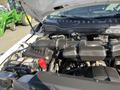 Engine compartment of a 2019 Ford F-350 SD showing the air intake and battery components