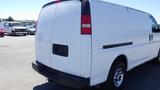 White 2012 GMC Savana van with a plain rear and silver wheel rims