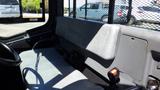 Interior view of a 2013 Kubota RTV 1100 showing the driver's seat and dashboard area with storage compartments and controls