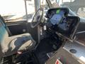 Interior view of a 2007 Ford Econoline showing the driver's seat and dashboard with various controls and gauges