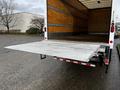 A 2022 Ford F-750 with a lowered hydraulic liftgate extending from the back of the truck