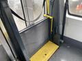 Interior of a 2017 Chevrolet Express showing the rear door with a foldable wheelchair ramp and safety strap