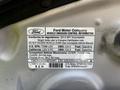 A label detailing vehicle emission control information for a 2013 Lincoln MKT including specifications and regulatory compliance data