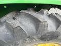 Close-up of a 2003 John Deere 790 tractor tire showing its rugged tread pattern and branding on the sidewall