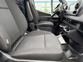 2019 Mercedes-Benz Sprinter interior featuring two black fabric front seats and a dashboard with control panel and cup holders