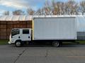 A 2017 Isuzu NPR box truck in white parked on a road with a plain cargo area and visible wheels