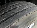 Close-up of a tire tread on a 2008 Ford F-750 showcasing detailed patterns of wear and grooves designed for traction and stability