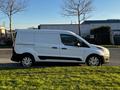 A white 2022 Ford Transit Connect van parked on grass with a simple design and sliding side doors