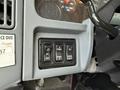 Controls for lights and panel features in a 2007 International 4200 truck including buttons for off panel on and work light