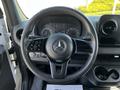 Steering wheel and dashboard of a 2022 Mercedes-Benz Sprinter showing speedometer and control buttons