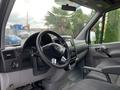 Interior view of a 2017 Mercedes-Benz Sprinter with a steering wheel dashboard and driver's seat visible