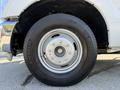 A close-up of a wheel from a 2016 Ford F-350 SD featuring a silver rim and a Michelin tire