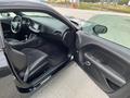 A 2017 Dodge Challenger with its driver's side door open showcasing the black interior and seating