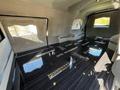 interior of a 2013 Lincoln MKT featuring a sleek floor with multiple metal tie-downs and a luxurious beige color scheme