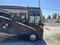 2008 Newmar Canyon Star 36 Foot Class A Motorhome featuring a sleek black exterior with decorative graphics and large windows