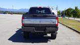 A 2017 Ford F-350 Super Duty viewed from the rear showing the tailgate and bumper design