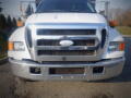 A front view of a white 2007 Ford F-650 with a chrome grille and large headlights