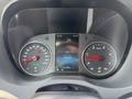 Dashboard display of a 2019 Mercedes-Benz Sprinter showing speedometer and odometer with a digital screen in the center