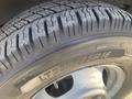 A close-up of a tire from a 2018 Chevrolet Express showing the tread pattern and sidewall specifications