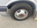 Close-up of a 2017 Chevrolet Express wheel with a tire showing visible wear and rust on the metal rim