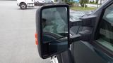 Close-up of the side mirror of a 2008 Ford F-450 SD showcasing its large rectangular shape and dual mirror functionality