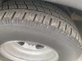 Close-up of a tire from a 2017 Chevrolet Express showing tread patterns and sidewall details