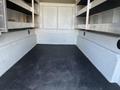 2019 Ford F-350 SD with a spacious truck bed featuring textured flooring and metal shelving along the sides