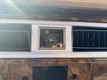 Interior view of a 1982 Mercury Grand Marquis dashboard featuring a clock and air vents