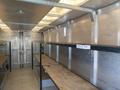 Interior of a 2006 Workhorse W42 with metal walls and empty shelves along the sides