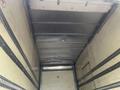 Interior view of a 2008 Hino 268 truck showing a metal ceiling with lights and exposed structural beams