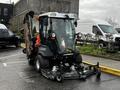 A 2020 Jacobsen HR800 mower with a front-mounted deck and raised rear attachment parked on a lot with vehicles in the background