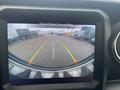 Rearview camera display showing a 2020 Jeep Wrangler with guide lines for parking assistance