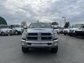 A 2010 Dodge Ram pickup truck facing forward with a chrome grille and bold front bumper