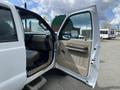 2010 Ford F-550 with an open driver's side door showing the interior and dashboard