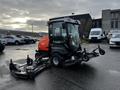 A 2020 Jacobsen HR800 lawn mower with dual cutting decks and an enclosed driver cabin parked in a lot