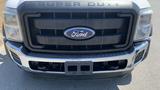 Front view of a 2011 Ford F-450 Super Duty featuring a prominent black grille with the Ford logo and a shiny chrome bumper