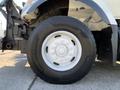 A close-up of a white rim with a large tire from a 2007 International 7300 truck