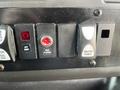 Controls on the dashboard of a 2018 Chevrolet Express including switches for lift door rear flasher and master power