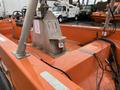 A 2008 Fassmer 20 Foot Fast Rescue boat with an orange deck featuring a central console and control panel along with visible electrical cables