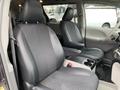 Interior view of a 2013 Toyota Sienna featuring two front seats with a center console and black fabric upholstery