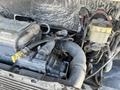 Close-up view of the engine compartment of a 2010 Freightliner MT45 Garbage Truck featuring various hoses and a visible engine part