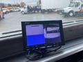 A monitor displaying multiple camera angles from a 2018 Hino 308 truck's interior