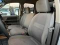 Interior of a 2008 Dodge Ram 5500 showing two grey fabric front seats with seatbelts and a view of the dashboard