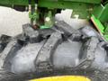 A close-up of a tire from a 2003 John Deere 790 tractor showing its tread pattern and size markings