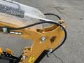 Close-up of a yellow 2024 AGT Mini Excavator's arm with hydraulic hoses and protective bubble wrap visible